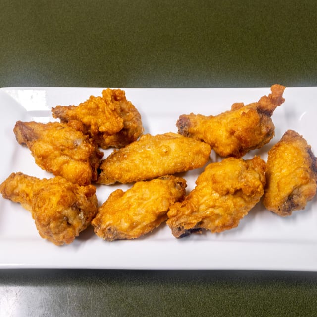 L25. Fried Chicken Wing with Honey, Sesame or General Tsao's Sauce.